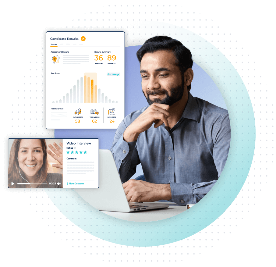 man looking at computer with Criteria score report and interviewing tool surrounding