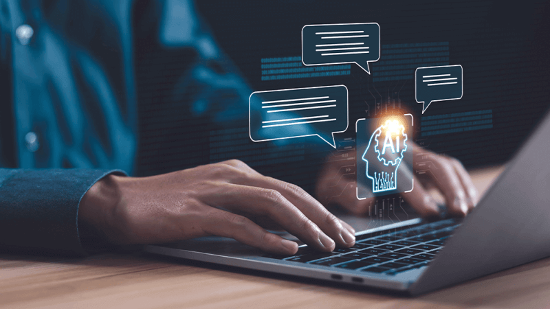 person sits at a computer and recieves answers from an AI chat bot