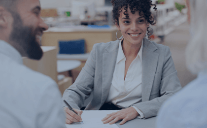 female banker smiling at customers