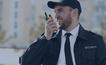 Security guard using walkie talkie