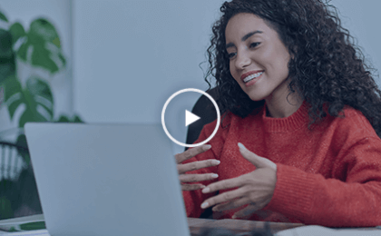 Woman on computer talking to screen